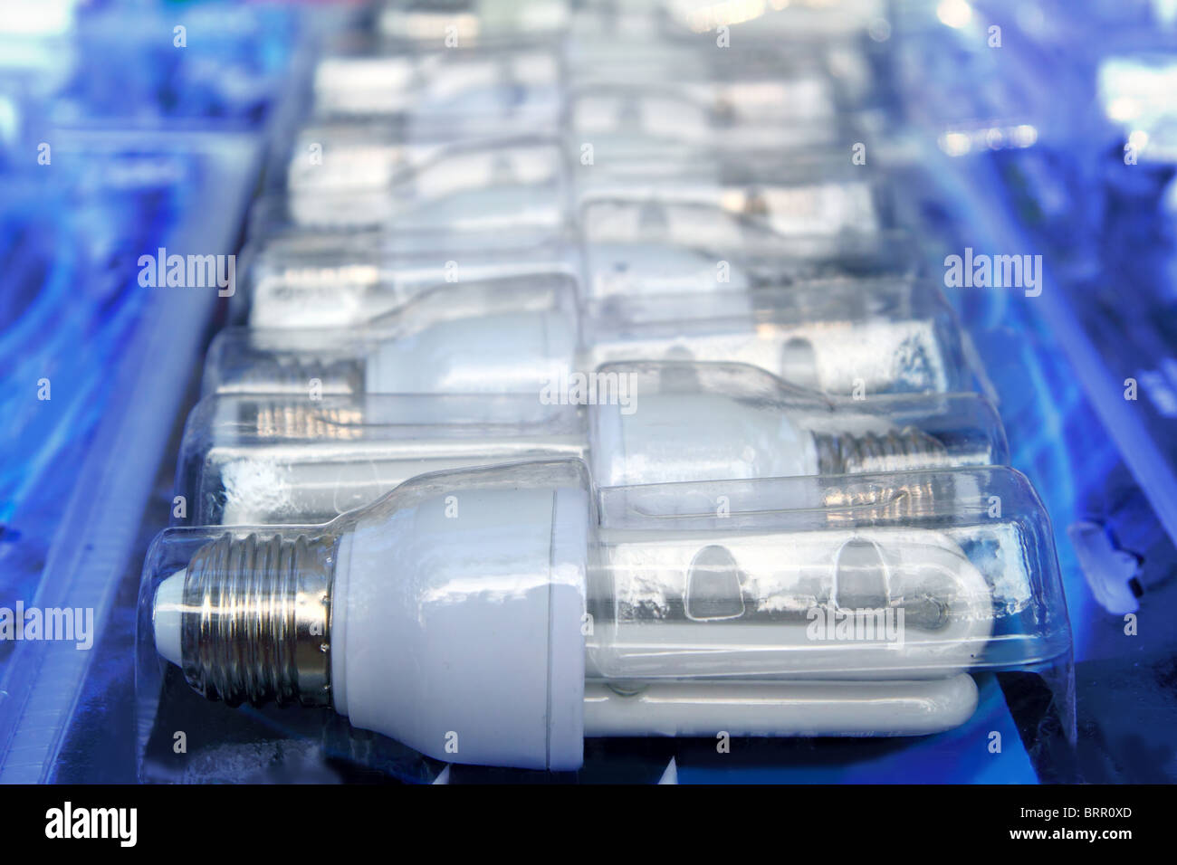 Energy saver light bulbs row new in blister in shop Stock Photo