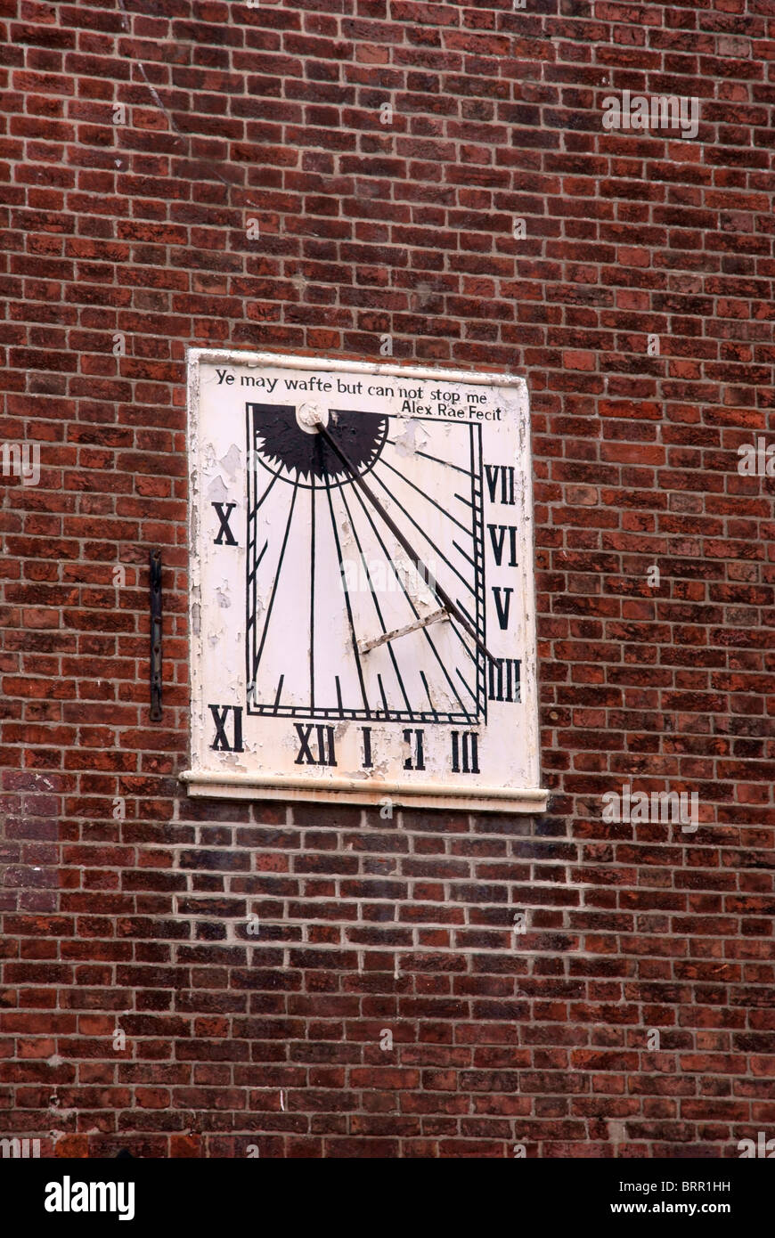 Sundial on a brick wall Stock Photo - Alamy