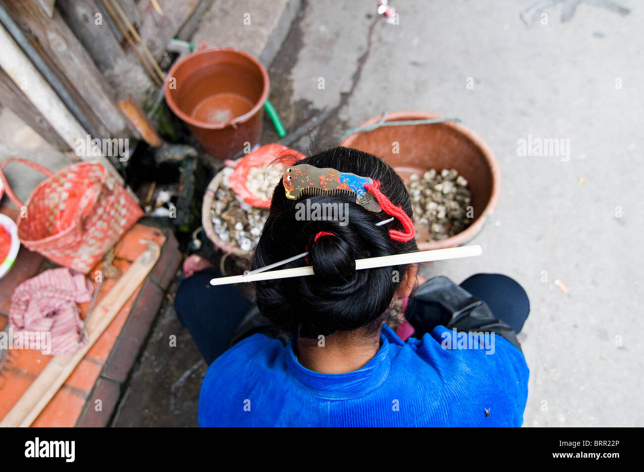 An Hui'an Chinese woman selling in the local village market. Stock Photo