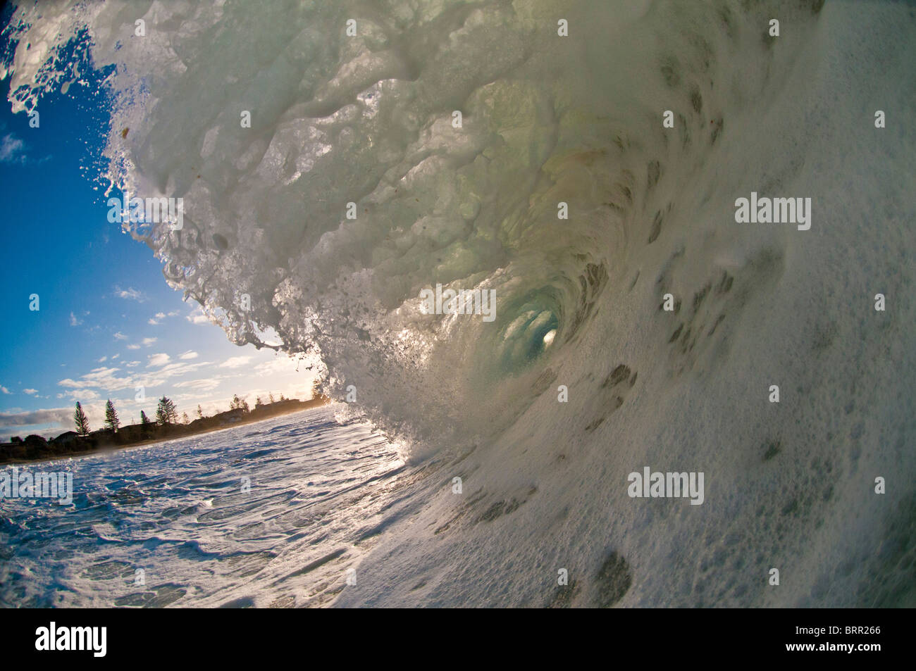 Foamy tubing wave shot from the water, Kirra, Queensland, Australia Stock Photo