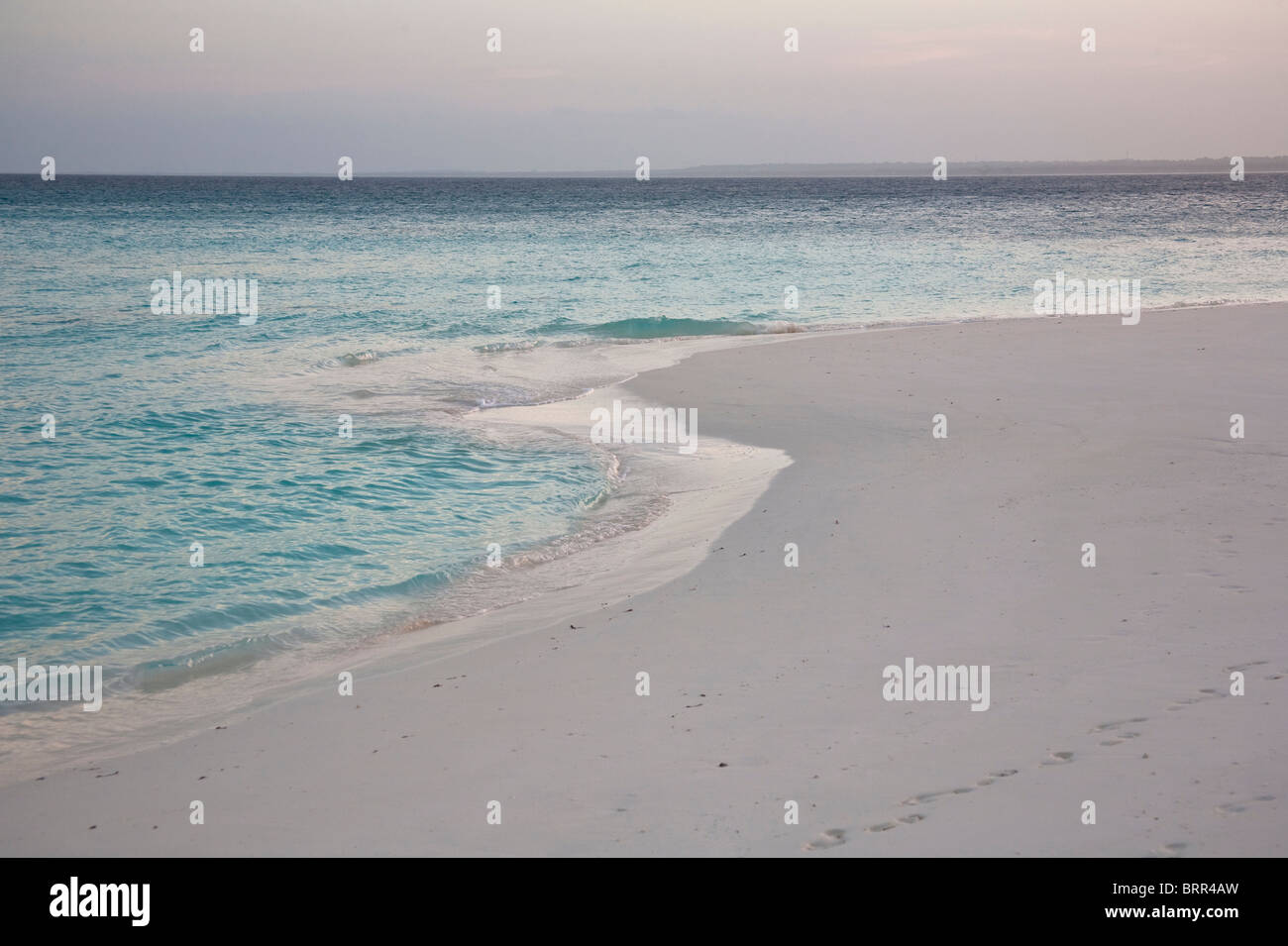 Tropical Island beach scene at dusk Stock Photo