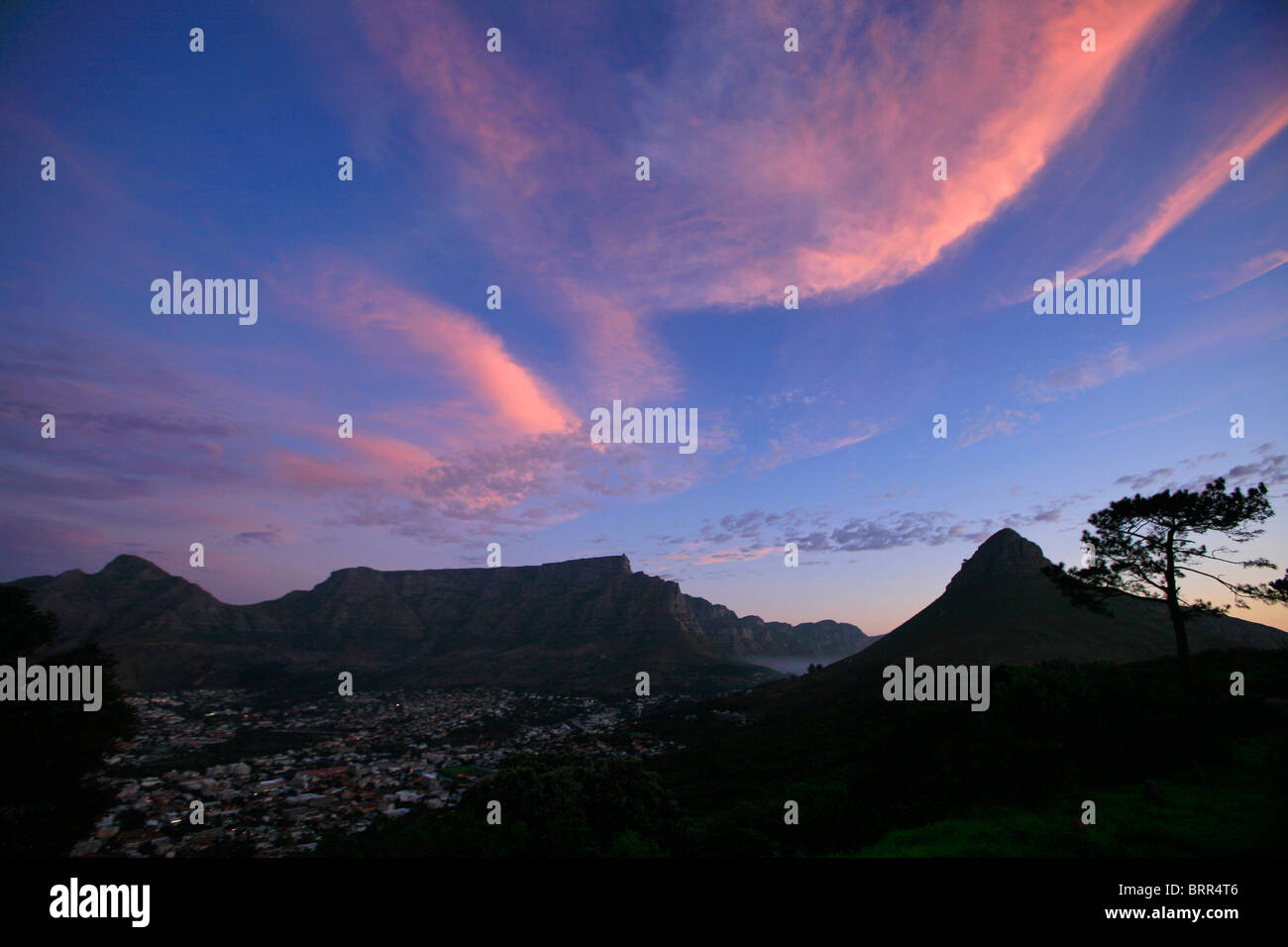 Table Mountain, Lions Head and Cape Town city bowl at sunset Stock Photo