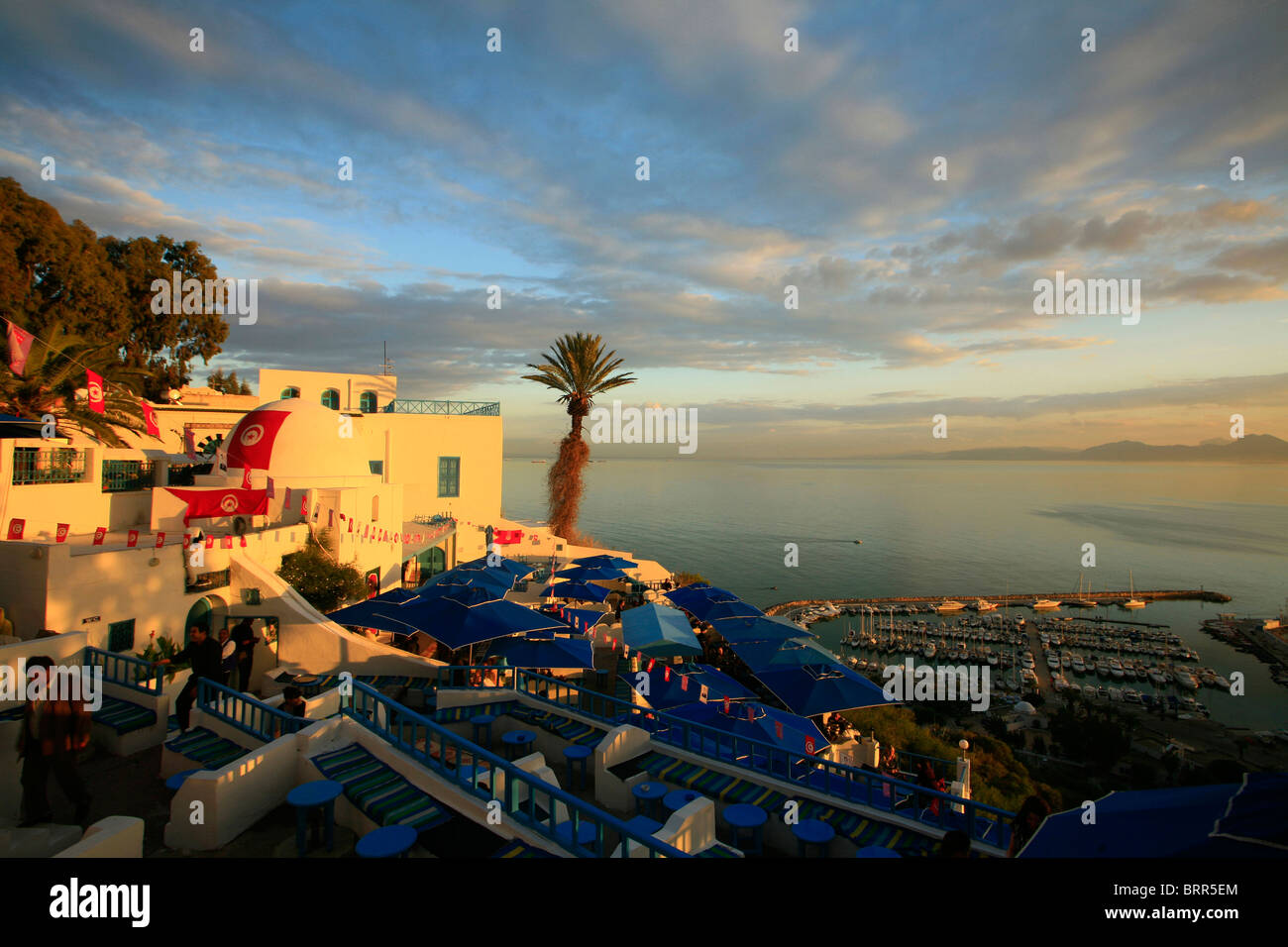 Sunset at a cafe in the upmarket suburb of Sidi Bou Said, a cliff top village popular with tourists near the capital Tunis. Stock Photo