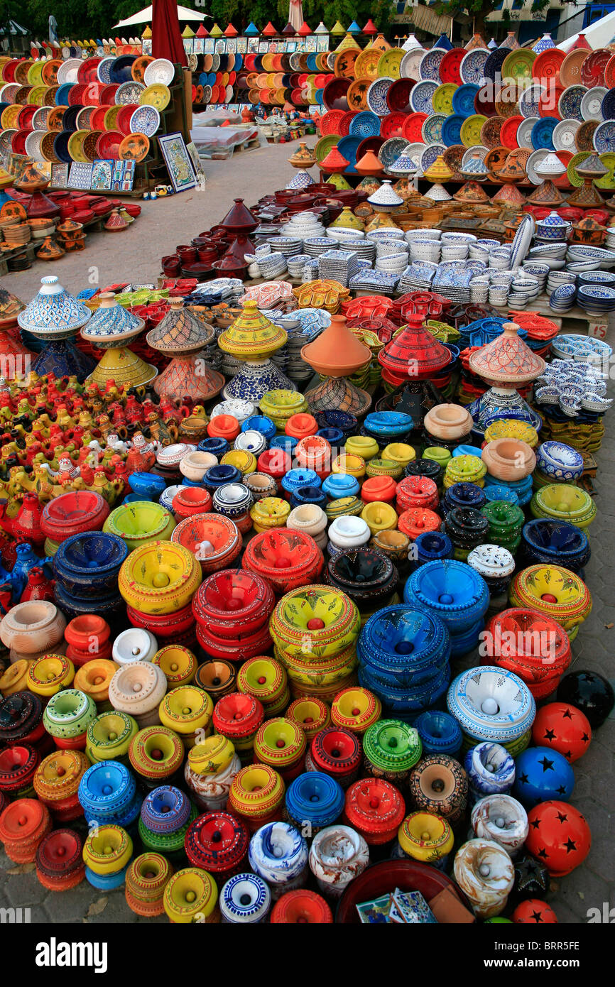 Vast display of multi-coloured pottery for sale at an outdoor market Stock Photo