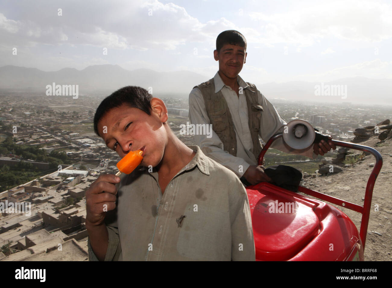 child eating icecream in kabul Stock Photo