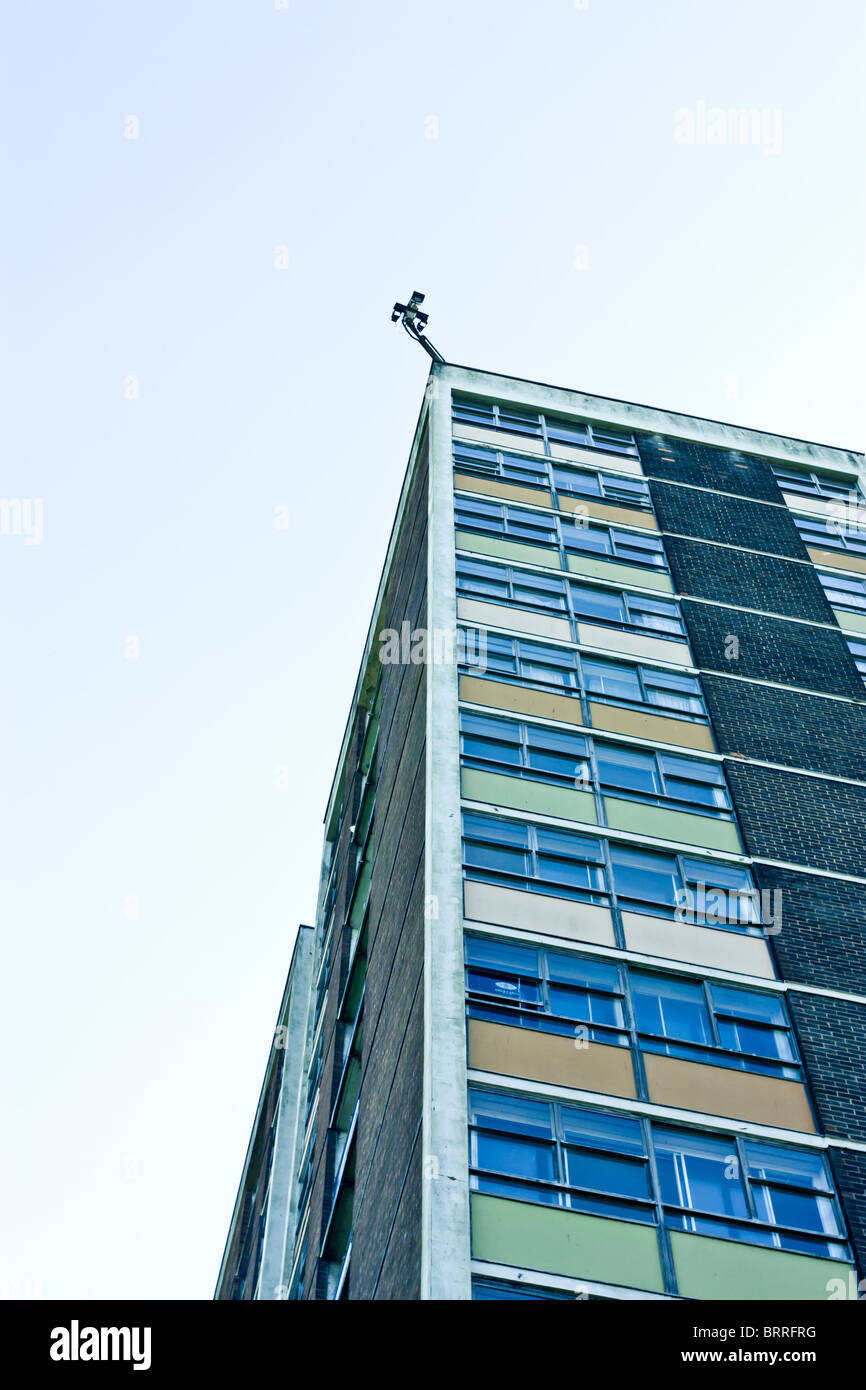 CCTV cameras atop of a dilapidated 1960' hi rise tower block. Stock Photo