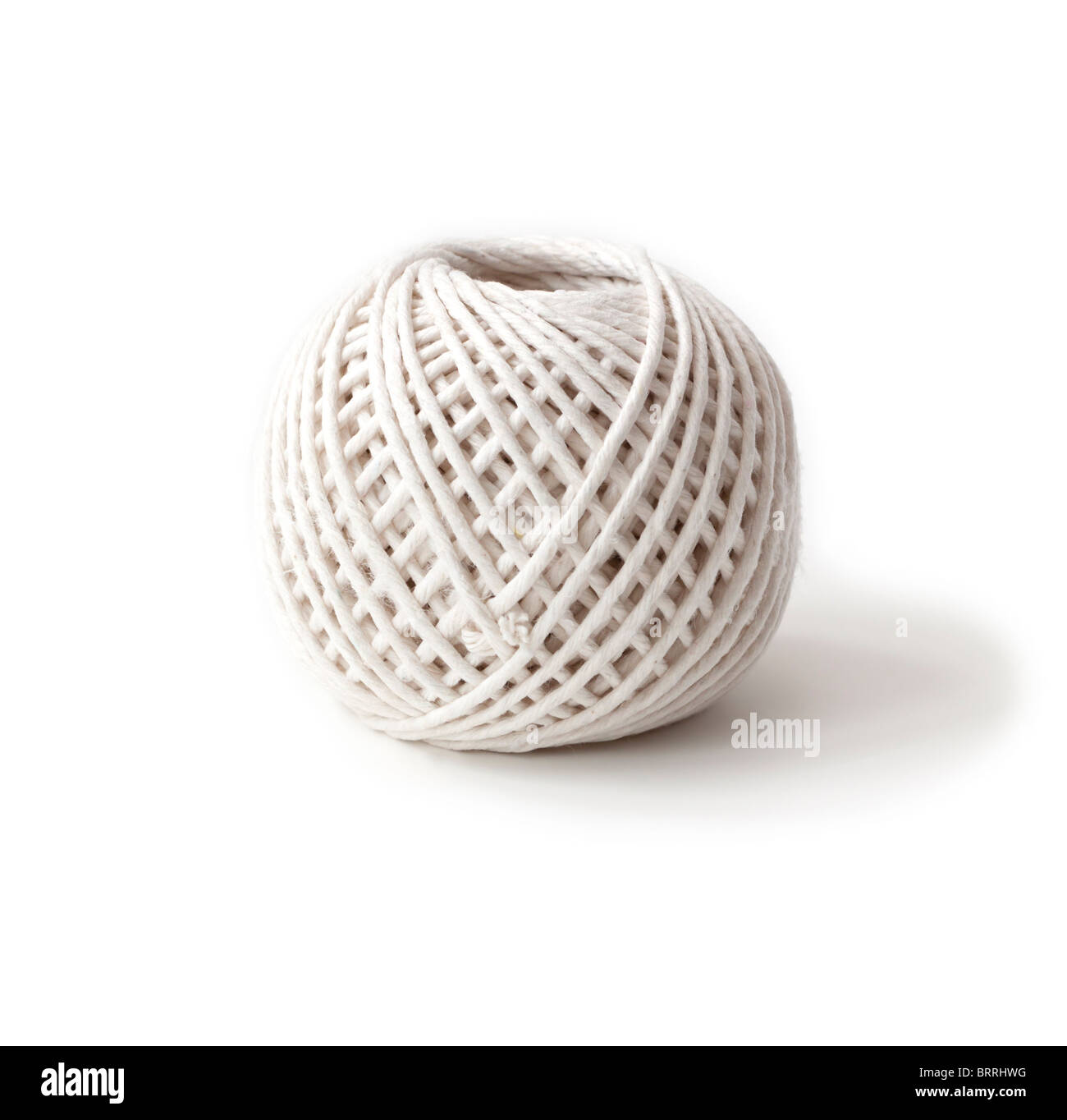 Ball of white string on a white background Stock Photo