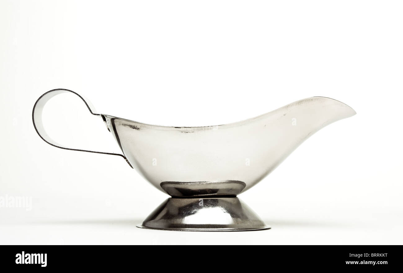 Shiny silver Gravy Boat from low perspective isolated against white. Stock Photo