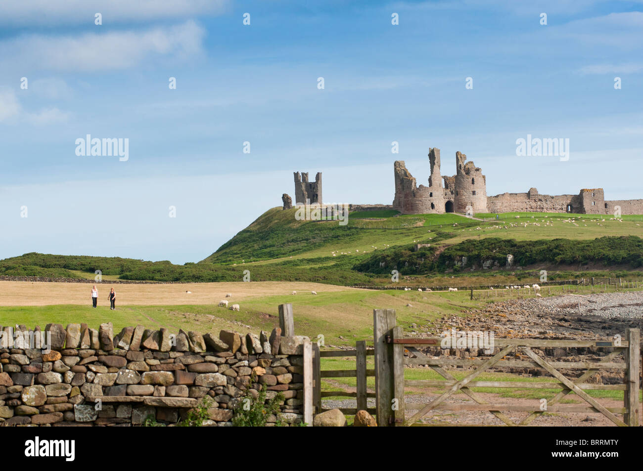 Dunstanburgh castle ruins in Northumberland, England Stock Photo
