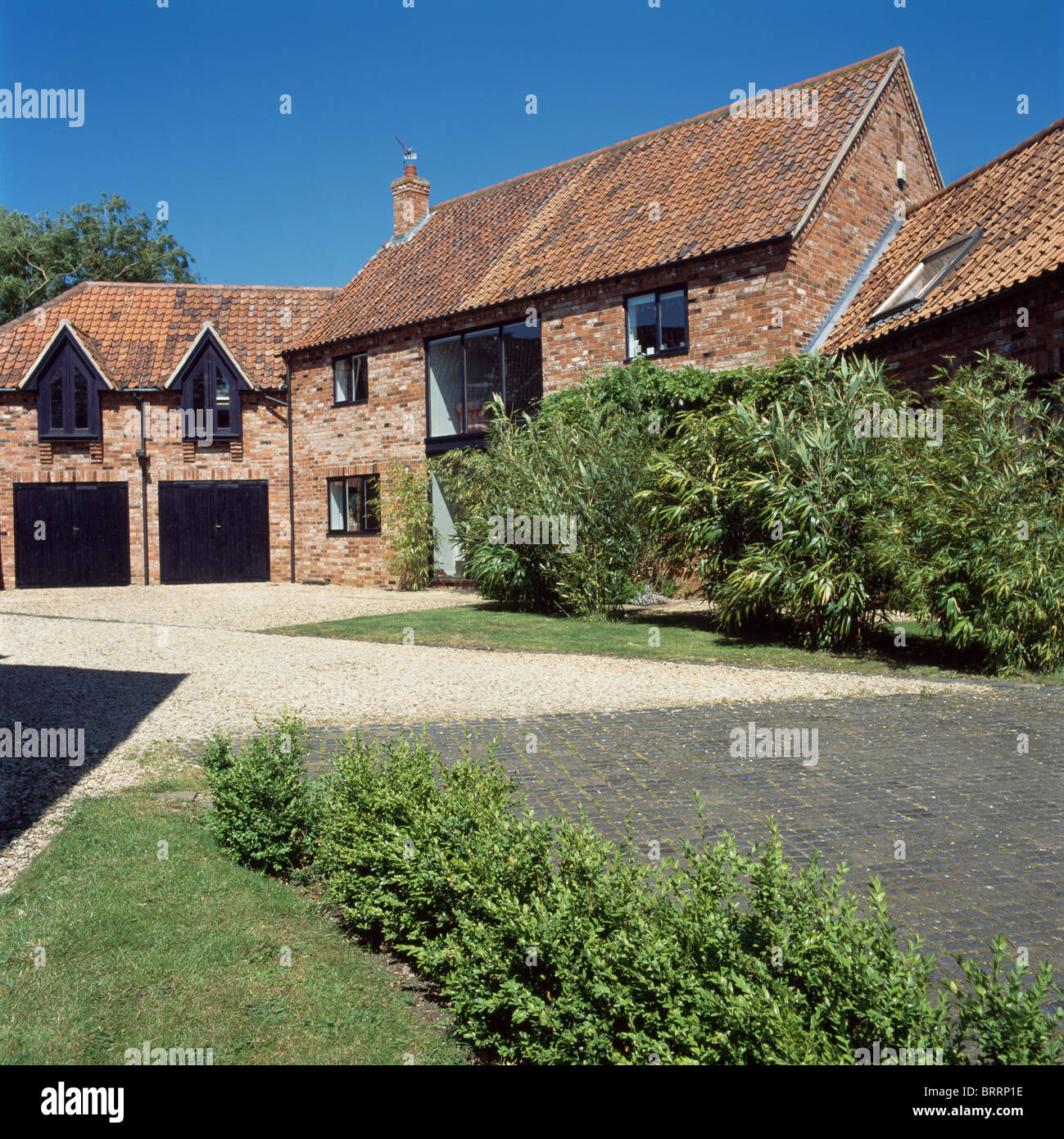 Drive In Front Of Brick Built Barn Conversion With Converted Stock