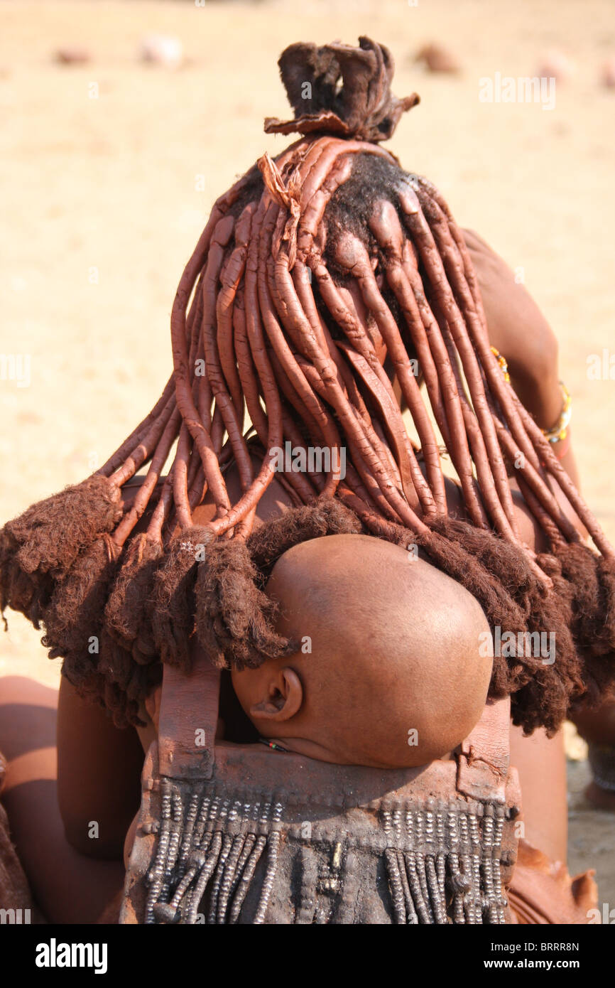 Himba people in the remote Opuwo region of Namibia Stock Photo