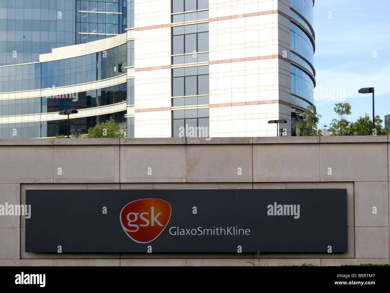 world headquarters of pharmaceutical company gsk, or glaxo smith kline, with name and logo in foreground Stock Photo