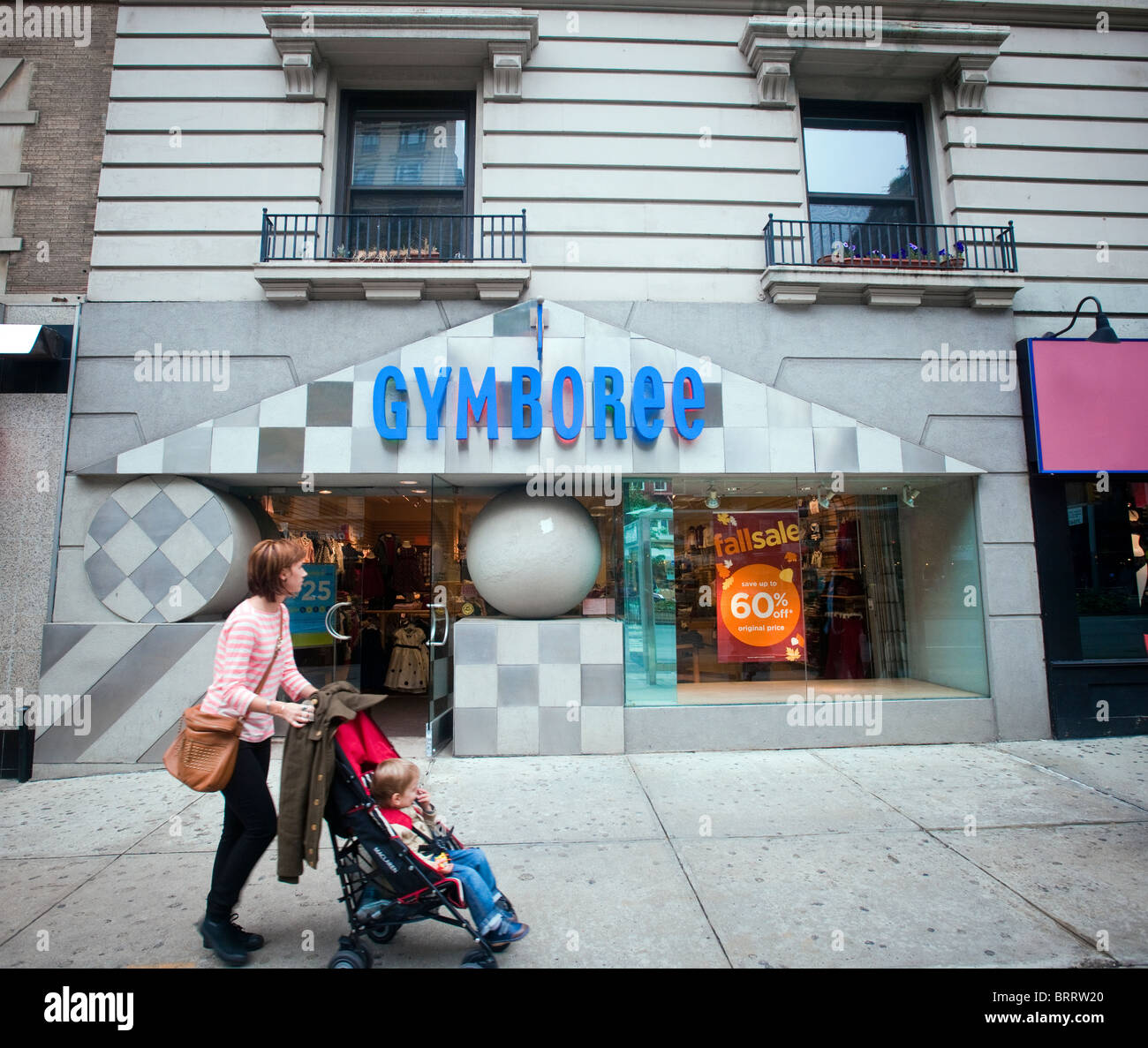 Shoppers pass by a Gymboree store on Broadway in New York Stock Photo