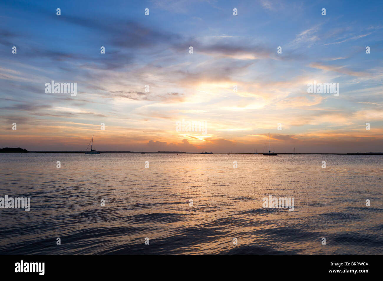 Sailing boat silhouette over sunset sky. Fernandina beach, Florida, USA Stock Photo