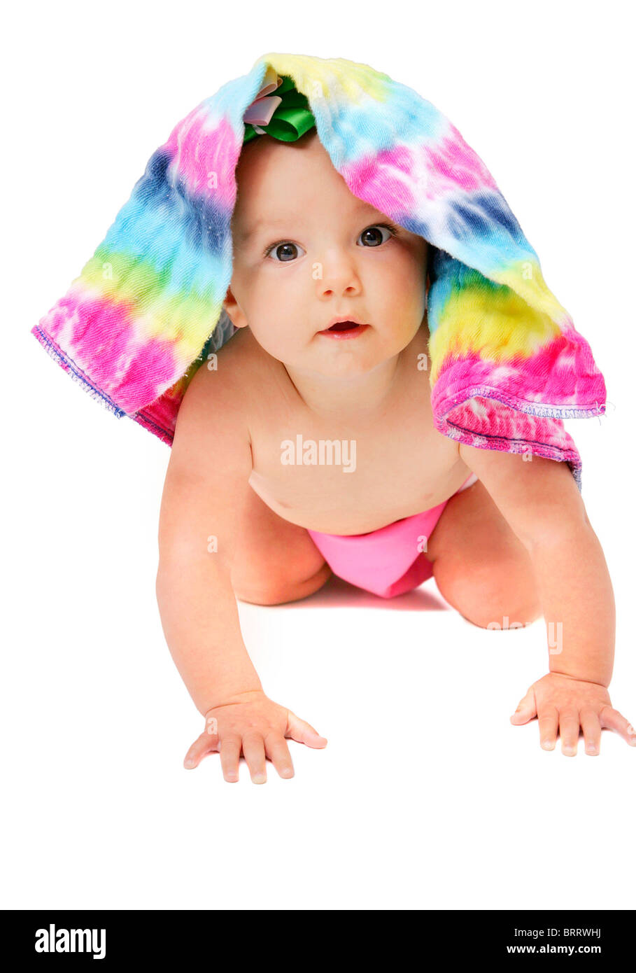 One Young Baby Girl Posing Under A Colorful Cloth Diaper Over White one-young-baby-girl-posing-under-a-colorful-cloth-diaper-over-white