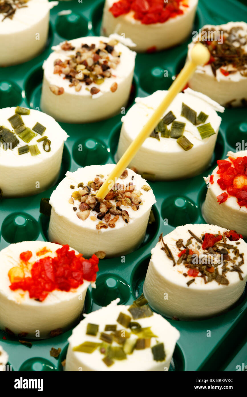 Cheese hors d'oeuvres with herbs, spices and skewers Stock Photo