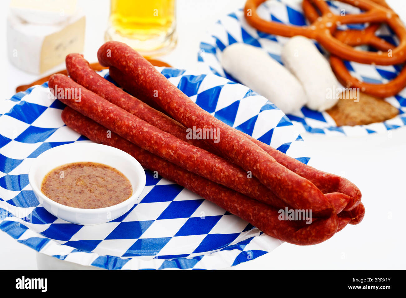 Ham Mettwurst sausages with sweet mustard, veal sausages, salted pretzels and beer, Bavarian Stock Photo