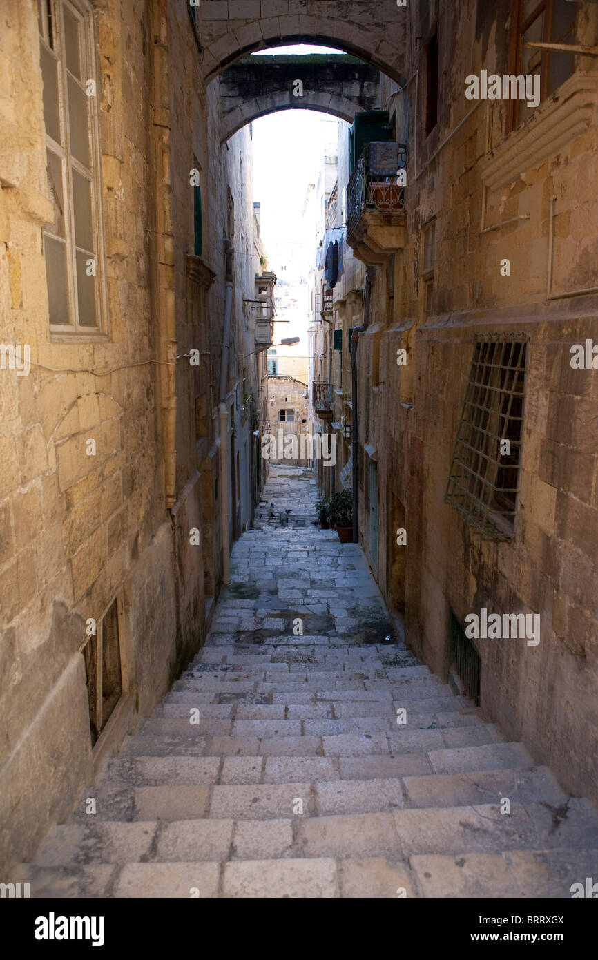 Narrow alley on St. Lucia Street, Valletta, Malta, Europe Stock Photo