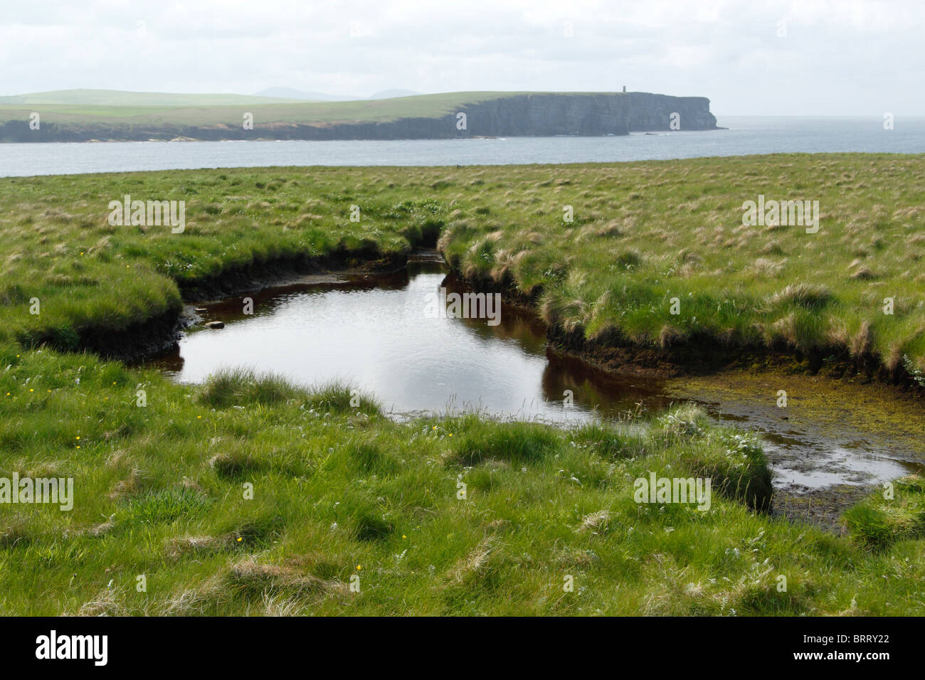 View of Markwick Head and the Kitchener Memorial from the Brough of Birsay, Orkney, Scotland Stock Photo