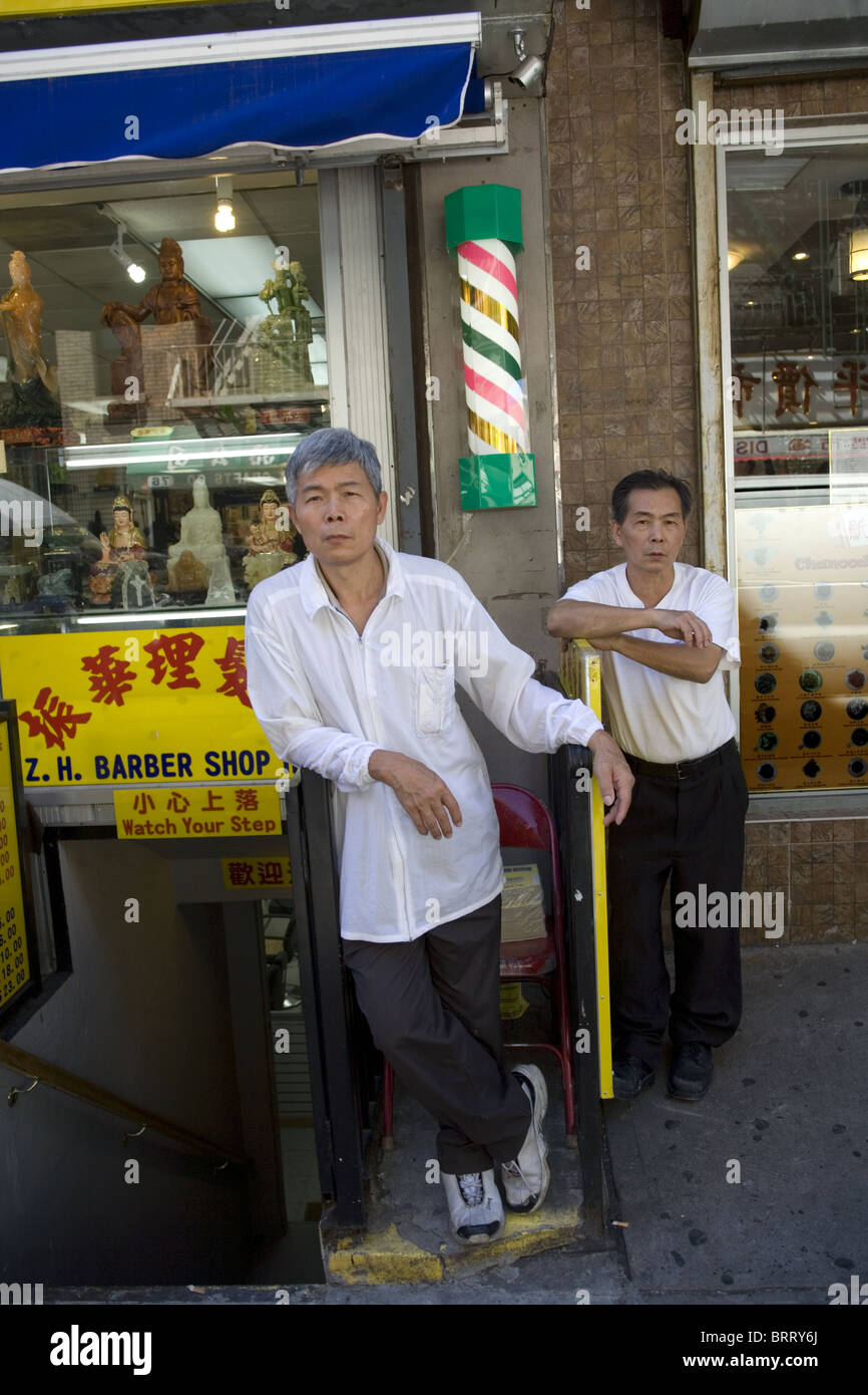 Barbers waiting for customers, Chinatown, New York City Stock Photo Alamy