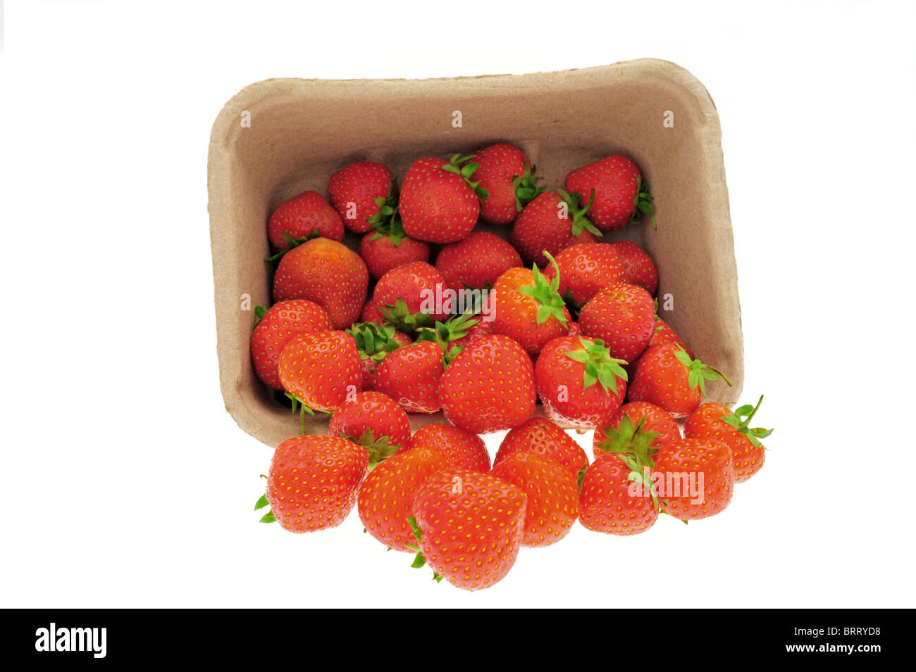 High key image of strawberries falling out of a punnet Stock Photo