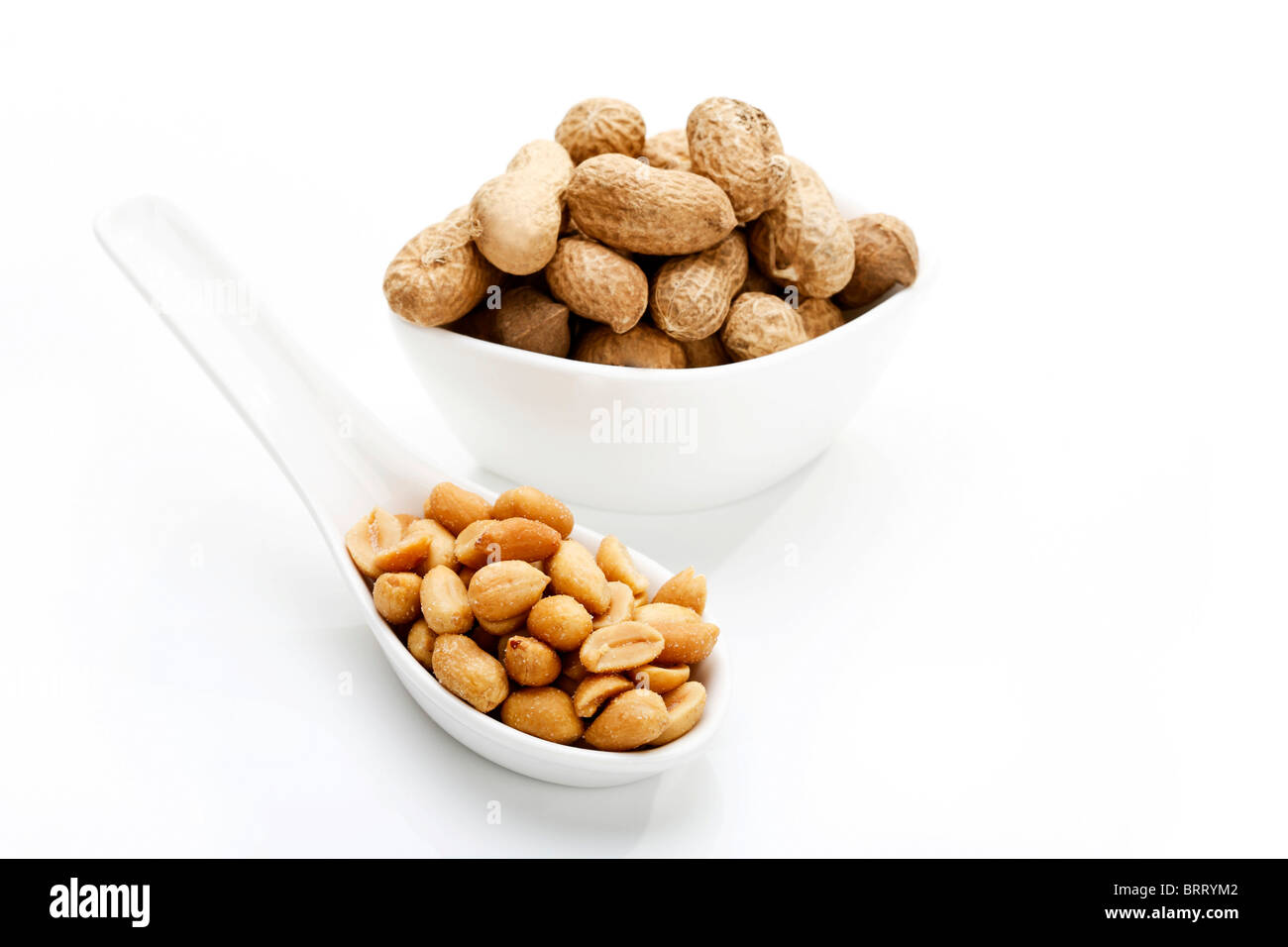 Salted peanuts and peanuts in shell Stock Photo