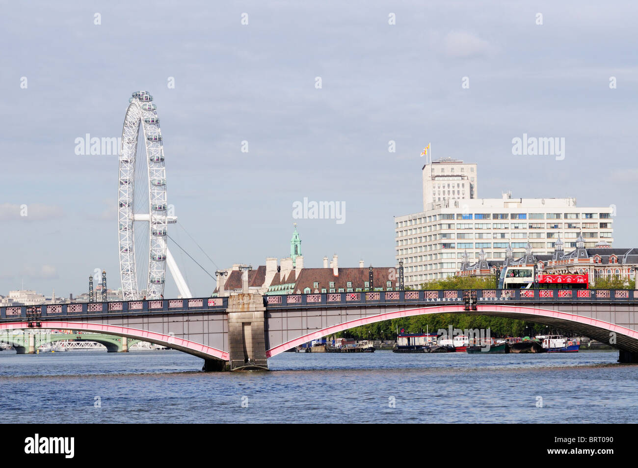 Lambeth Bridge, The London Eye and St Thomas' Hospital, viewed from Millbank Pier, London, England, UK Stock Photo