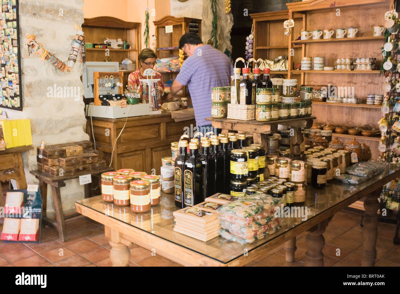 Customer buying honey in shop selling typical Spanish products. Stock Photo