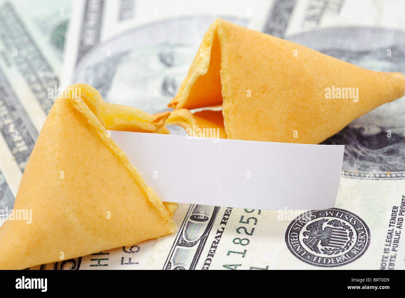 Fortune cookie with blank fortune on money Stock Photo Alamy
