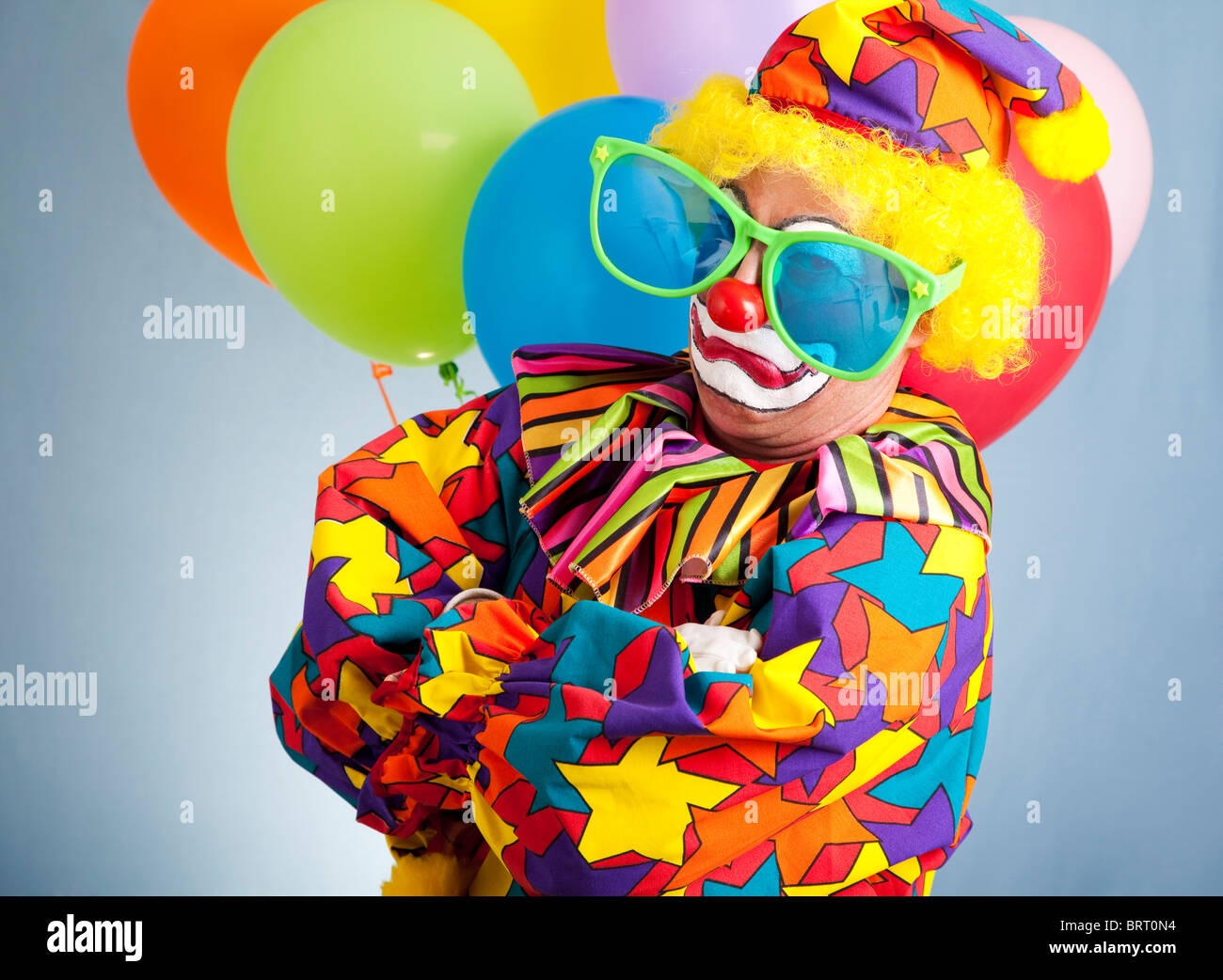Funny clown with oversized glasses making a gangsta pose Stock Photo ...