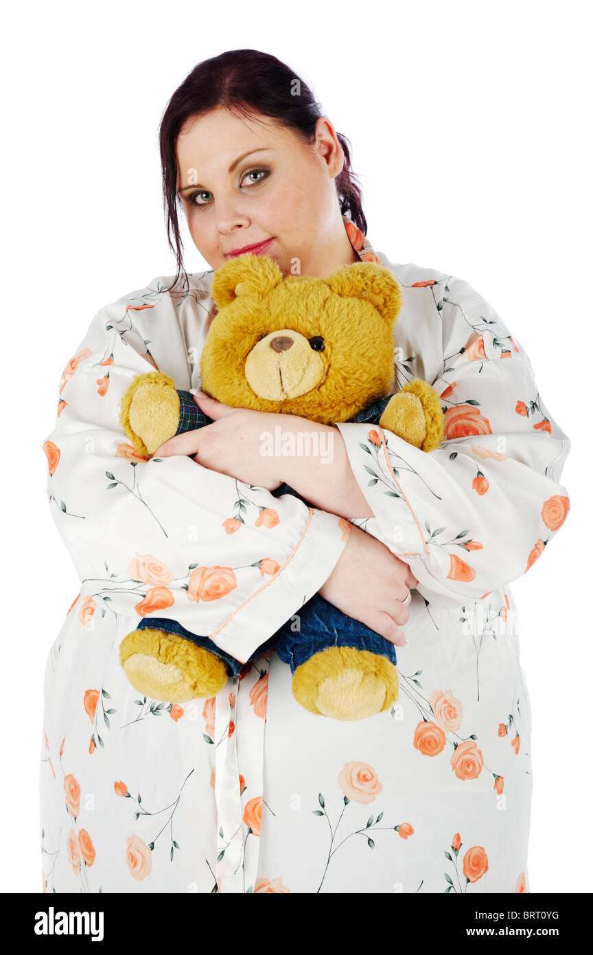 Young, fat woman holding a teddy bear Stock Photo