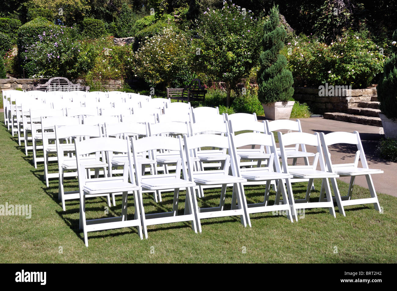 Rows of white chairs Stock Photo - Alamy