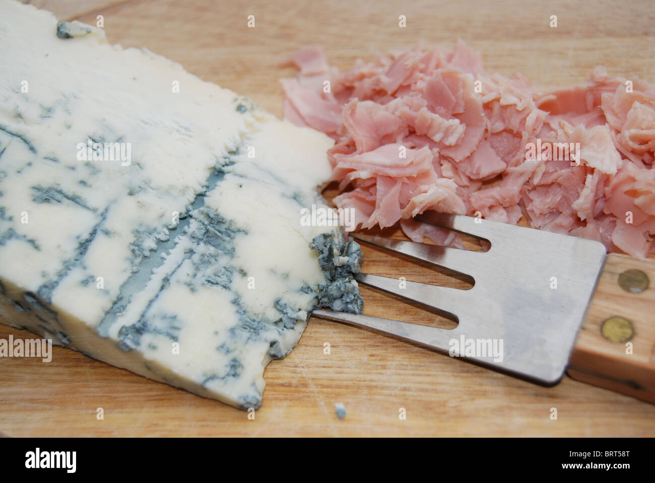 gorgonzola, typical aromatic italian cheese, and cooked ham Stock Photo