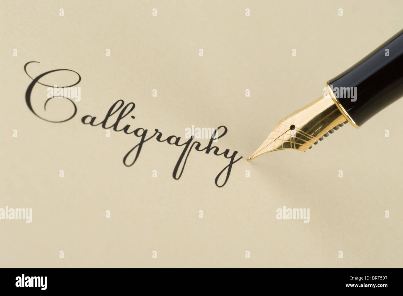 Inscription Calligraphy with gold pen Stock Photo