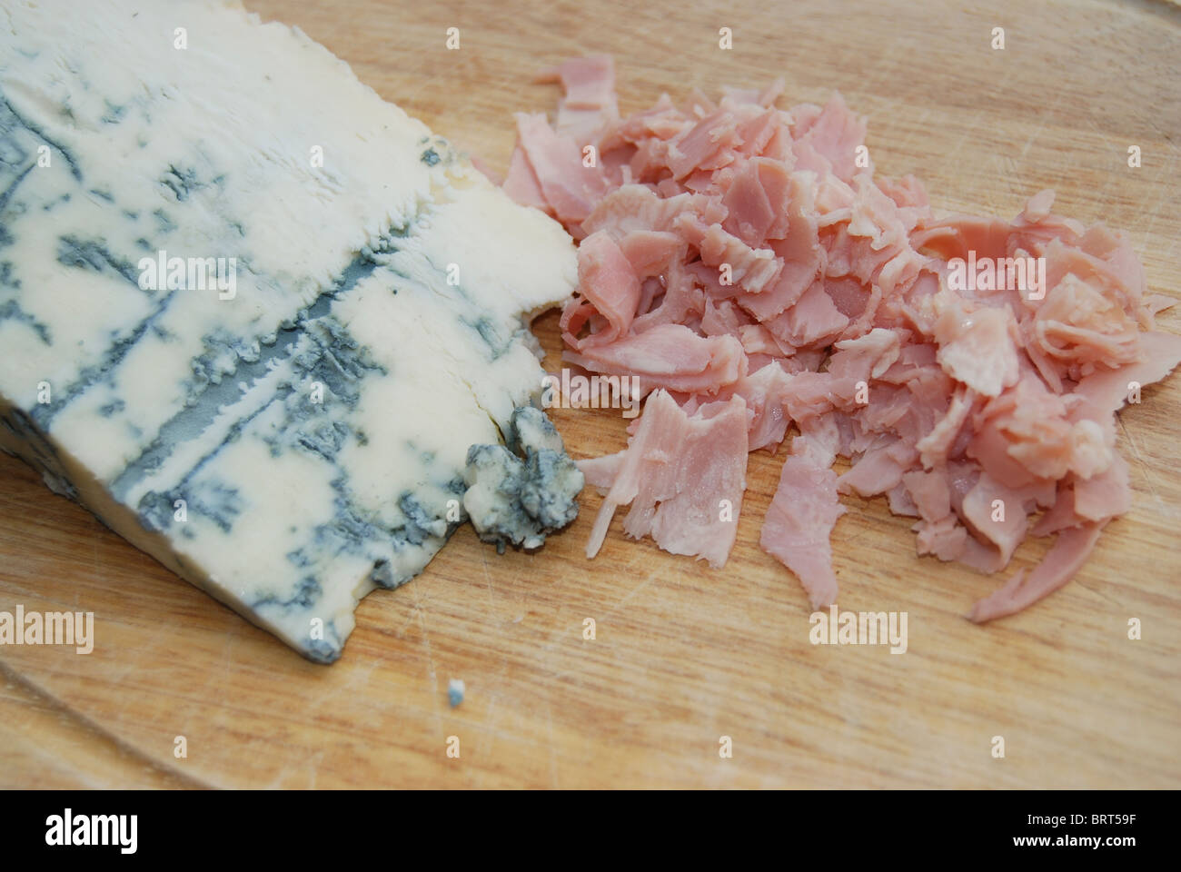 gorgonzola, typical aromatic italian cheese, and cooked ham Stock Photo