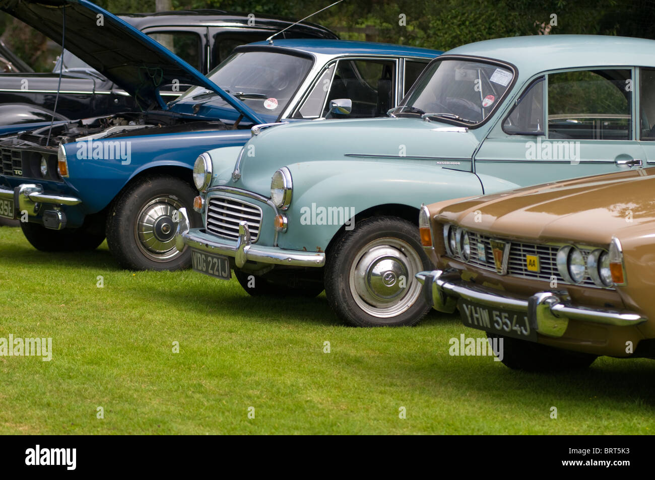 Vintage cars on display at a summer fair held in Cornwall, England