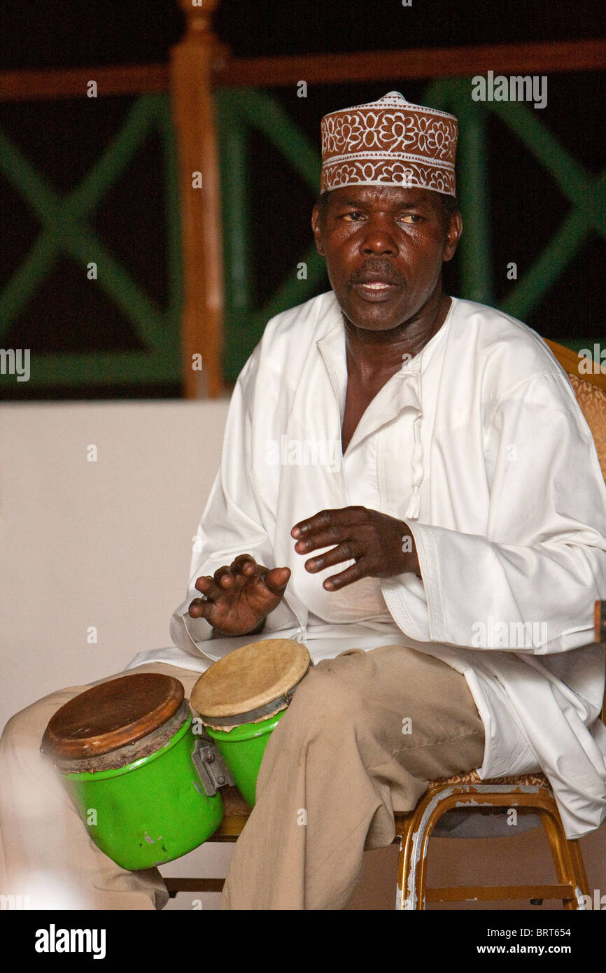 Zanzibar, Tanzania. Member of Twinkling Star Taarab Musical Group, a part of the Nadi Akhwan Safaa, Playing the Drums. Stock Photo