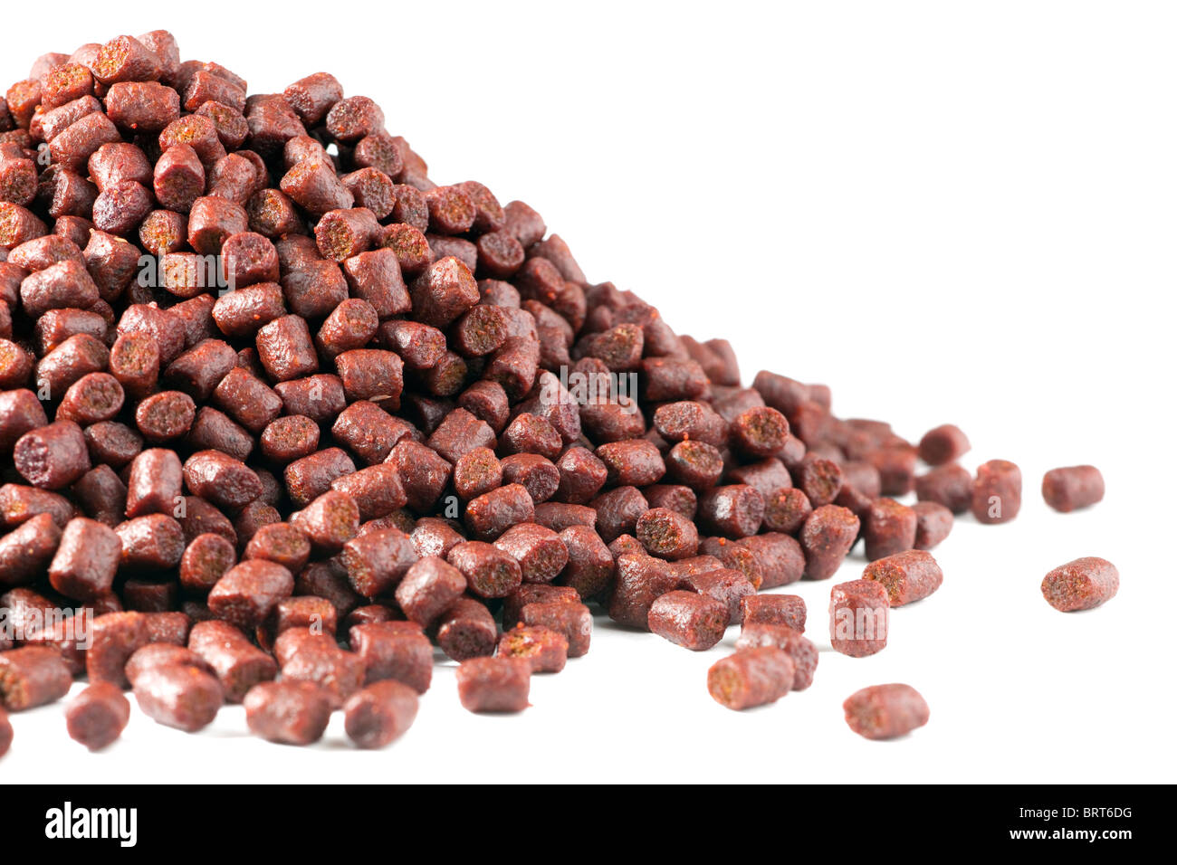 Pile of 6mm red fishmeal fishing pellets Stock Photo Alamy