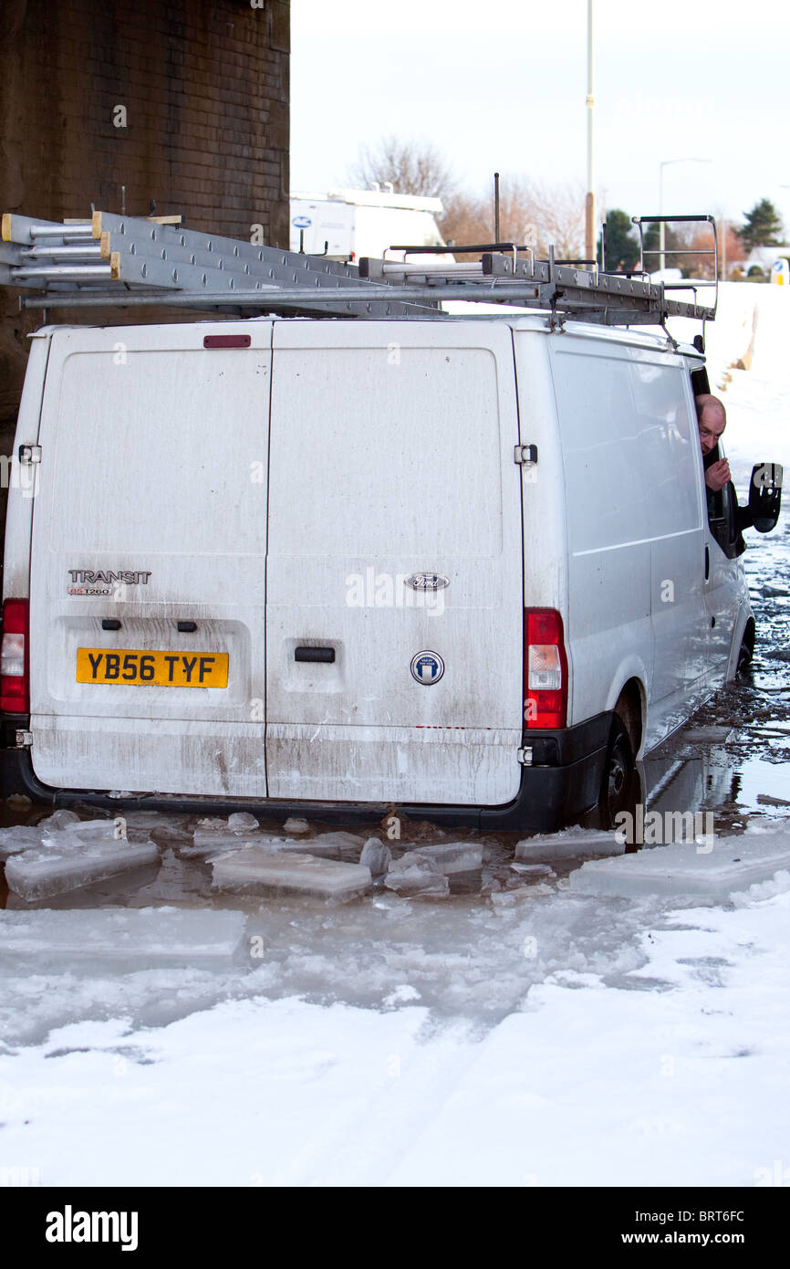 dangers of winter driving. Submerged van in winter flood Scotland UK Stock Photo