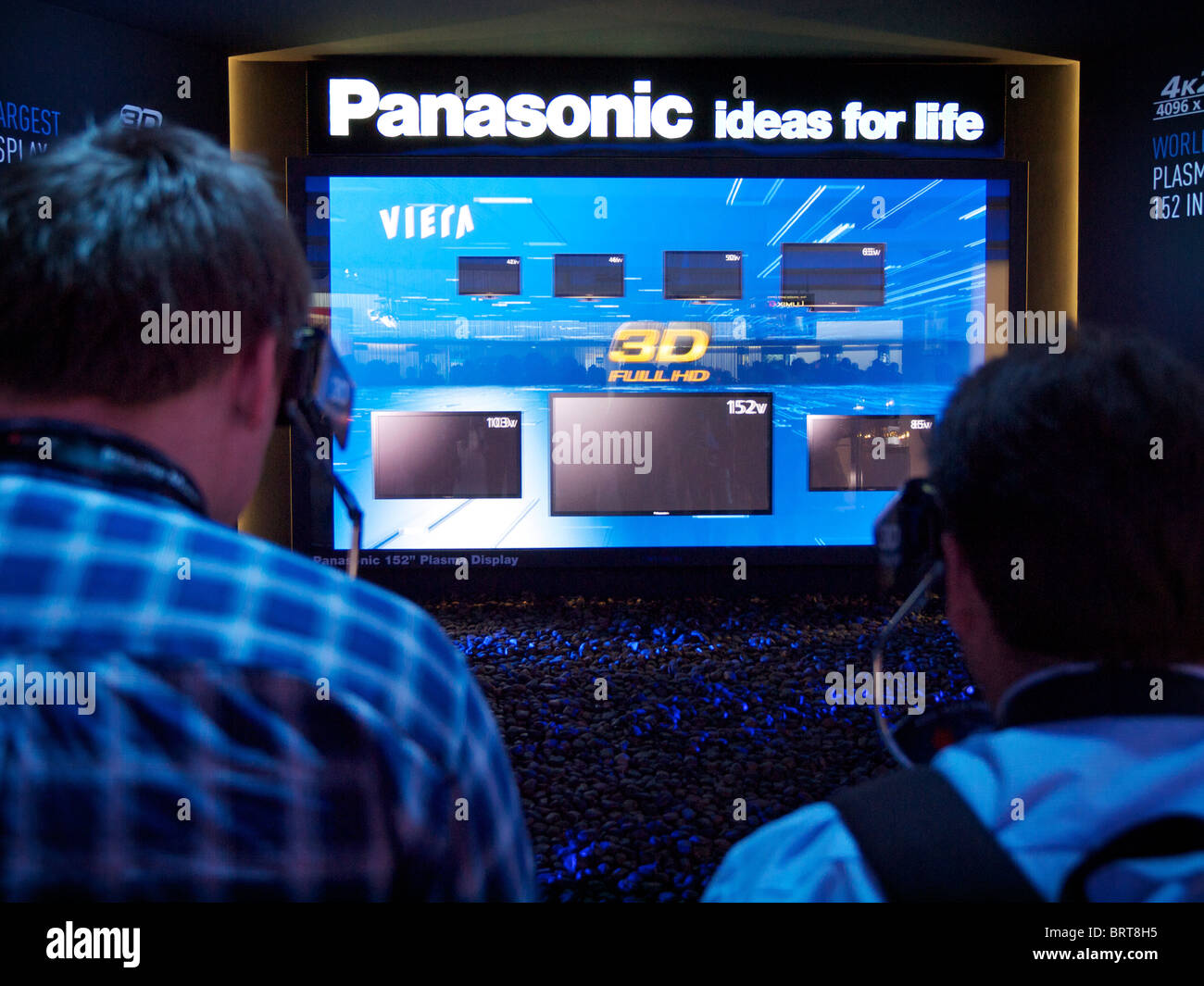 Two men trying out Panasonic 3D full HD television on Photokina trade fair in Cologne, Germany Stock Photo