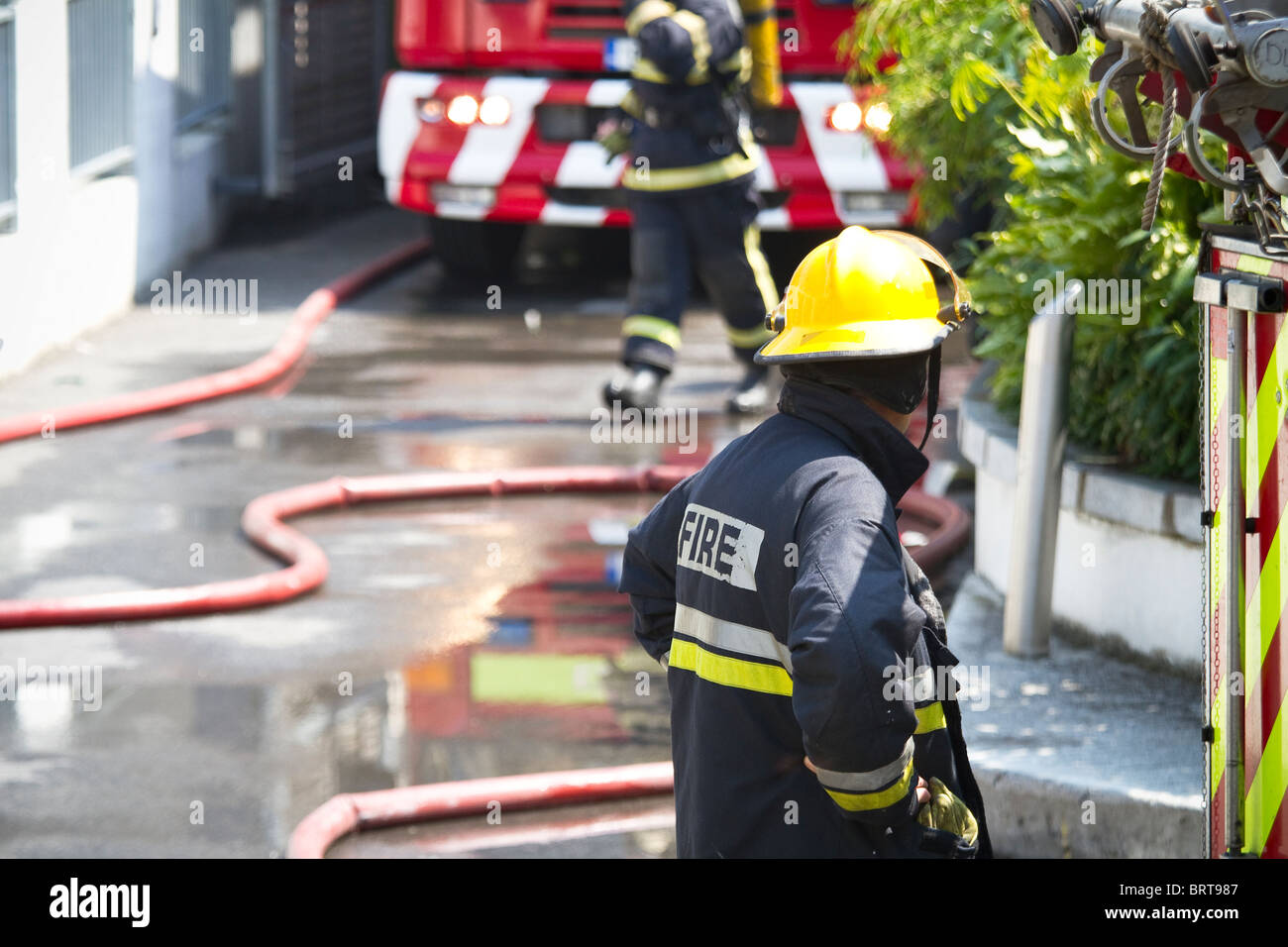 Firefighter brigade at work. Shallow depth of field Stock Photo Alamy