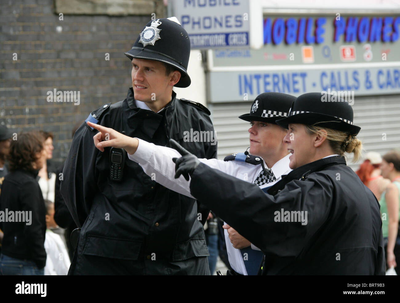 A Police Man and Two Police Women at the Notting Hill Carnival 2010 Stock Photo
