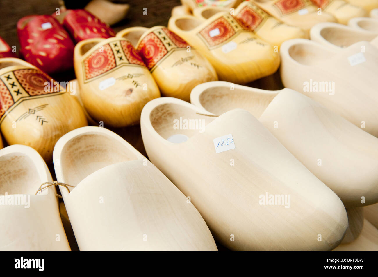 Many different Dutch wooden clogs at the market in Holland Stock Photo