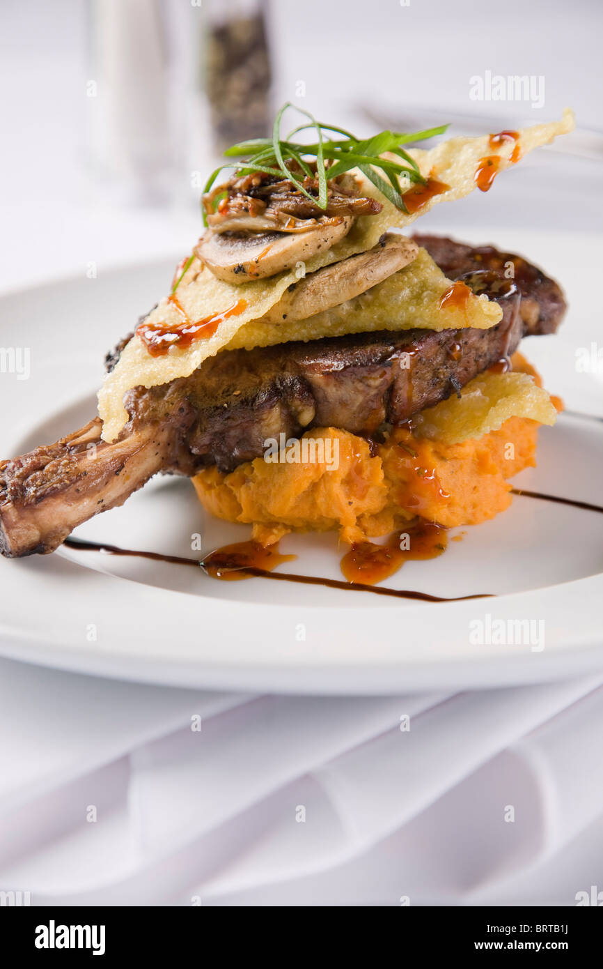 TBone Steak served on sweet potato mash Stock Photo Alamy