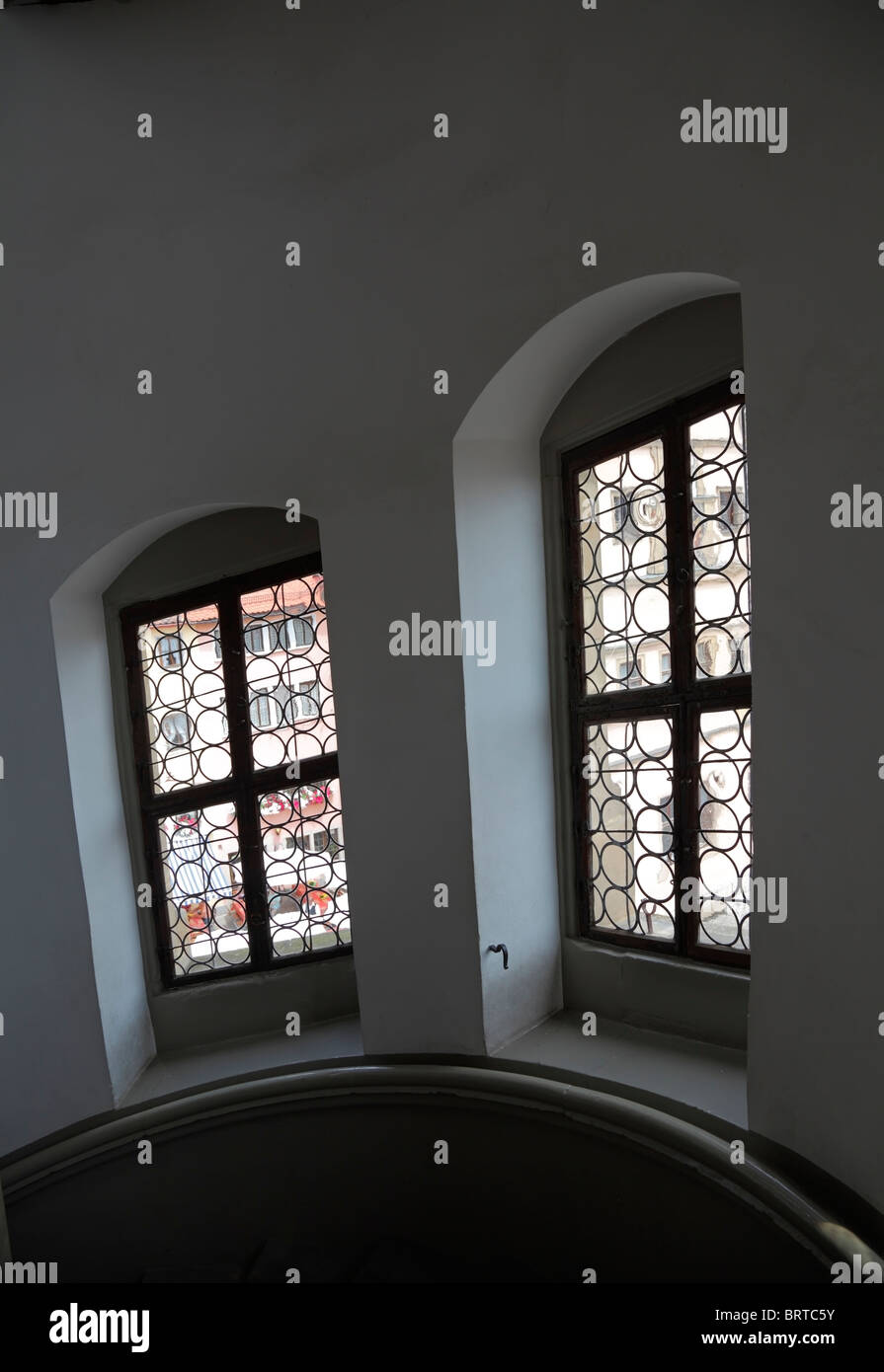 Leaded windows in the round staircase in the town hall tower in medieval city Rothenburg ob der Tauber, Germany Stock Photo