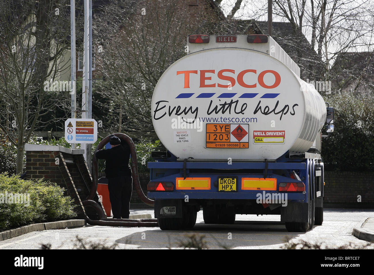 A Tesco Fuel Tanker restock supplies at a Petrol station. Picture by James Boardman Stock Photo
