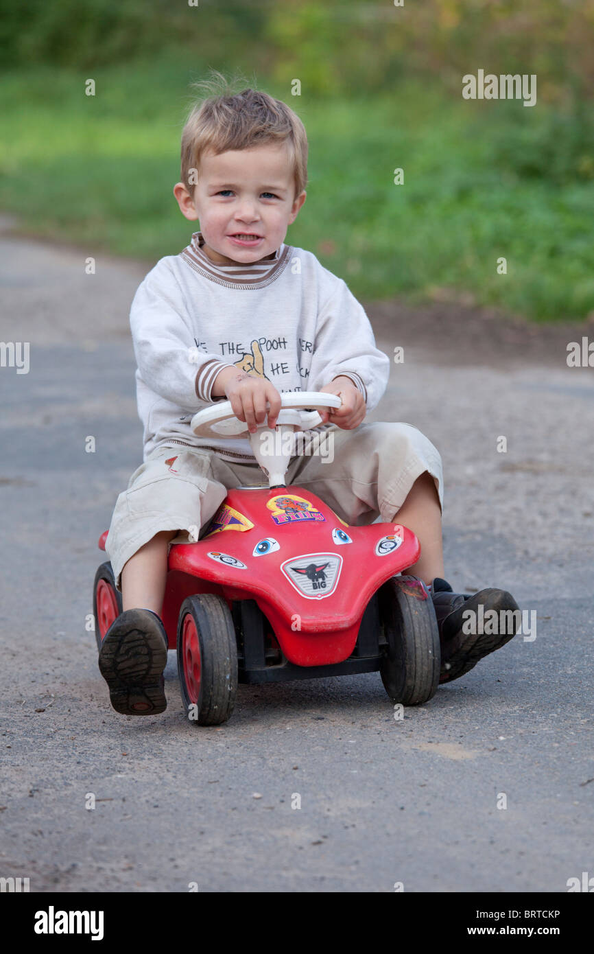 Little boy on bobby car hi-res stock photography and images - Alamy
