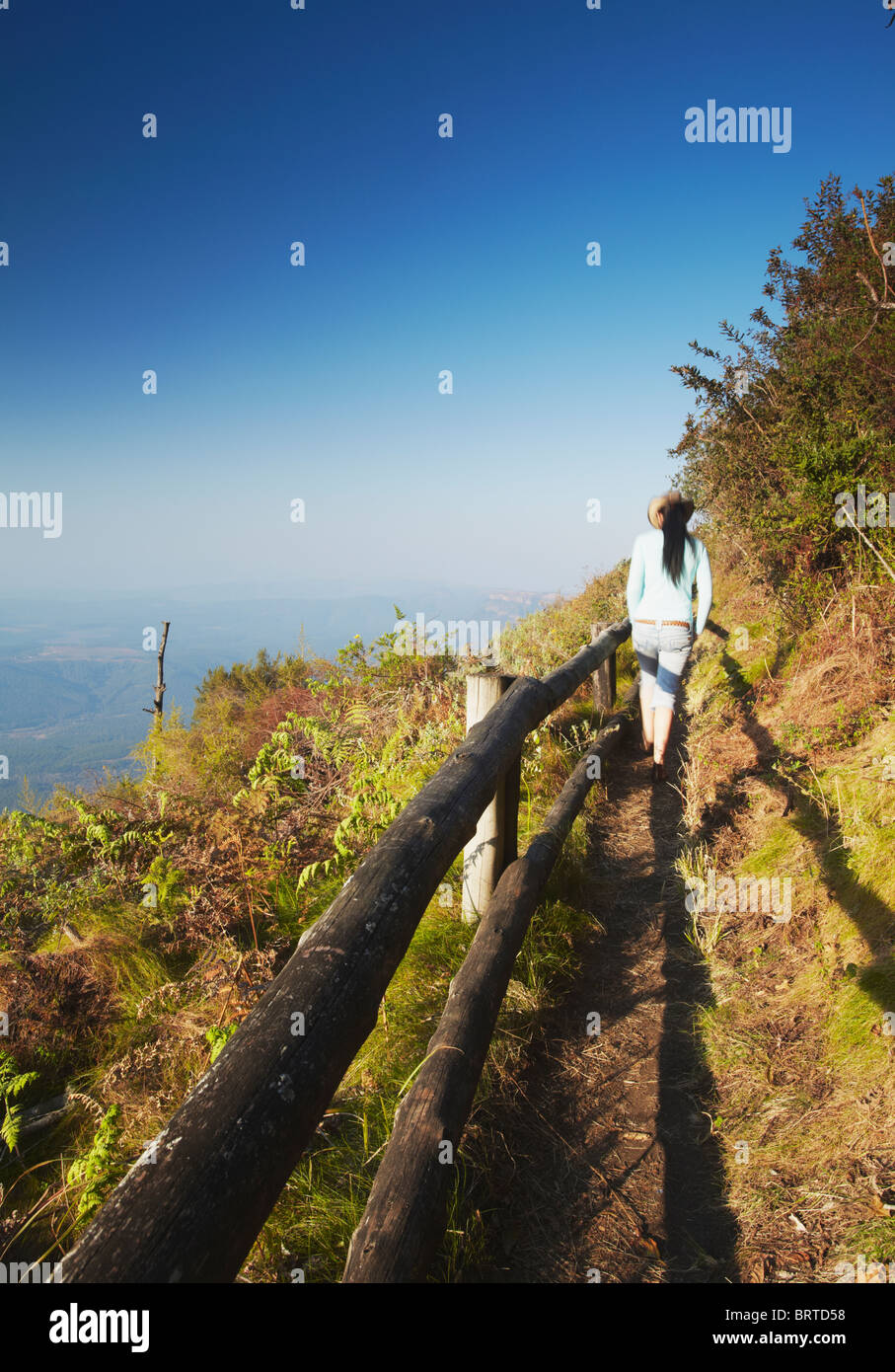 Woman walking at Wonder View, Drakensberg Escarpment, Mpumalanga, South Africa (MR) Stock Photo