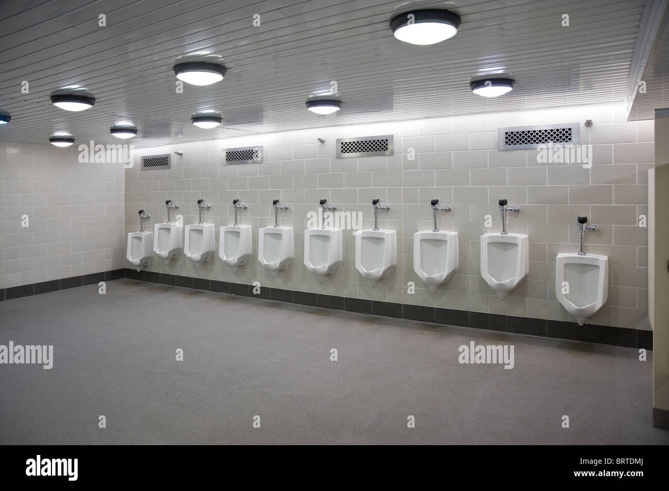 Men's Public Bathroom With Urinals, Chicago, USA Stock Photo