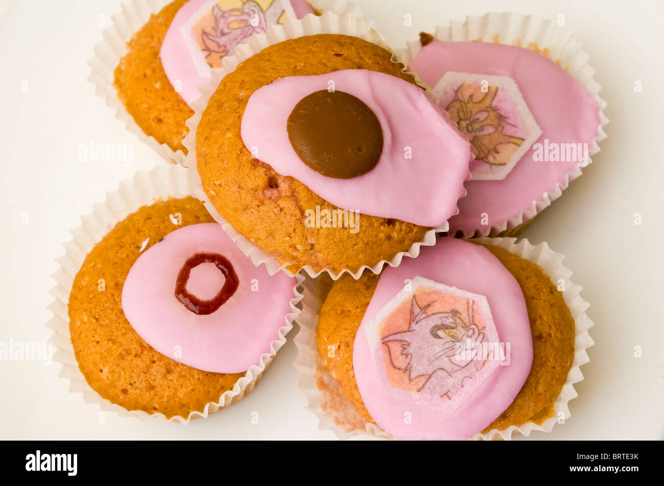 Home Made Fairy Cakes On A White Plate Stock Photo